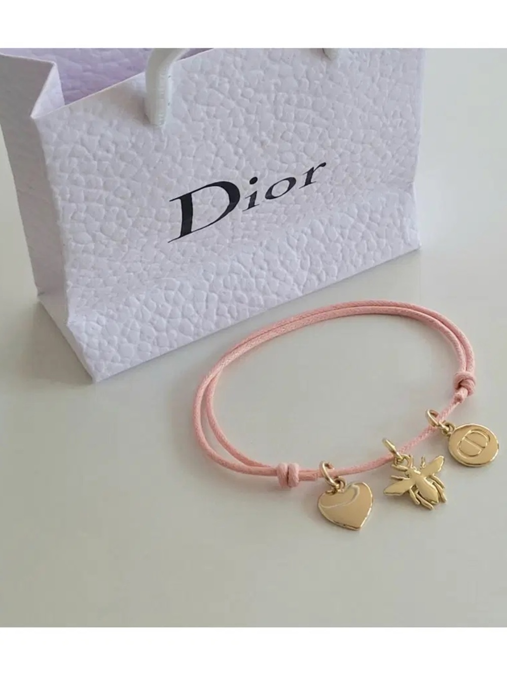 Dior bracelet brand new, never used. Signature Bee, Heart and CD logo charms